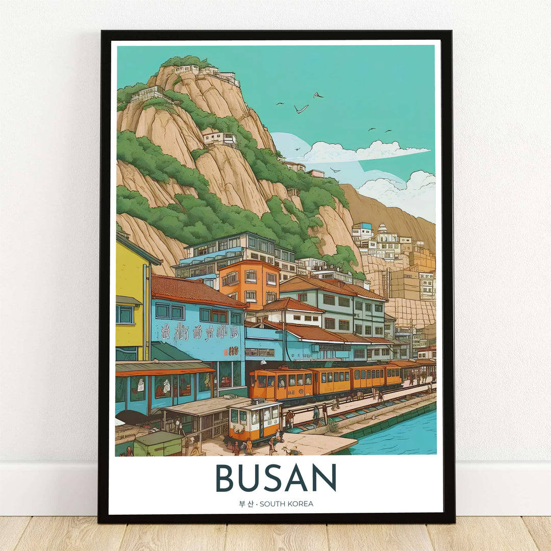 Detailed vector illustration art print depicting a vibrant seaside village in Busan, South Korea, complete with colorful hillside buildings, a coastal yellow train line, and rocky cliffs along turquoise waters. Offered by MapYourDreams, this artwork is available in flexible options including unframed paper, custom wooden frames, and gallery canvas wraps.