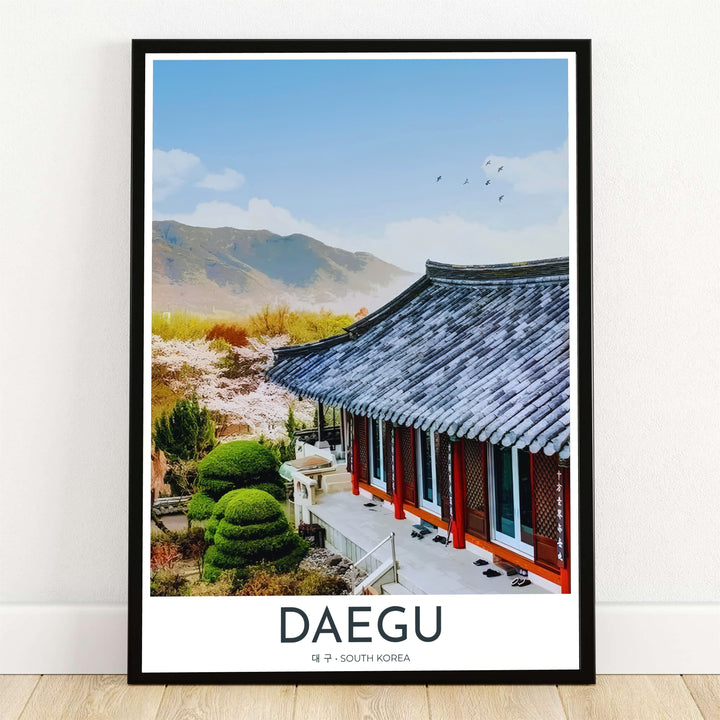 Scenic travel art print showcasing Donghwasa Temple in Daegu, South Korea, with curved grey tiled roofs, vibrant orange pillars, manicured topiary shrubs, and cherry blossoms against mountain slopes. Offered by MapYourDreams, this artwork is available in flexible options including unframed paper, custom wooden frames, and gallery canvas wraps.