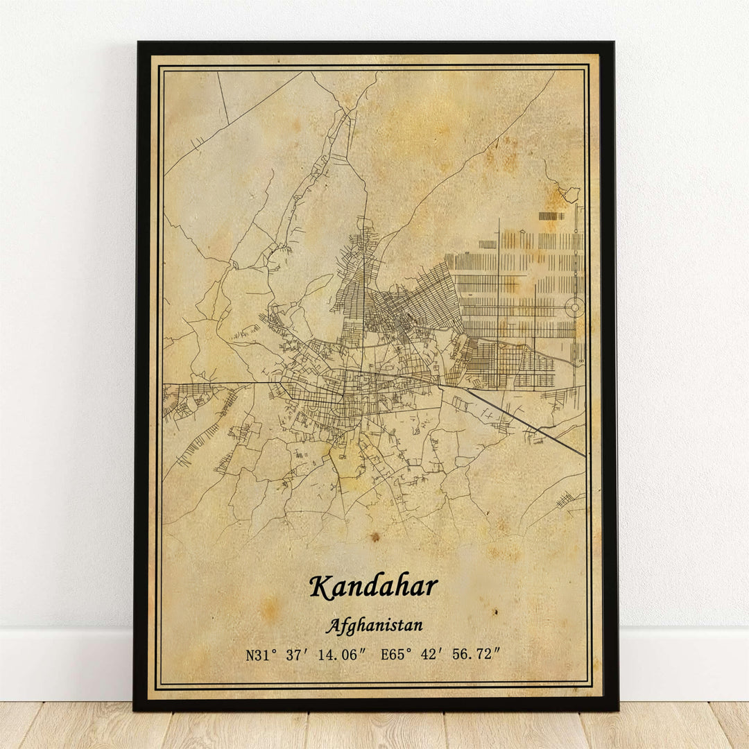 Antique cartography wall poster showcasing the city street grid and roads of Kandahar, Afghanistan, printed on an aged sepia parchment background with geographic coordinates. MapYourDreams supplies this map artwork as an unframed art print, a stretched canvas display, or a sleek black framed poster for modern offices.