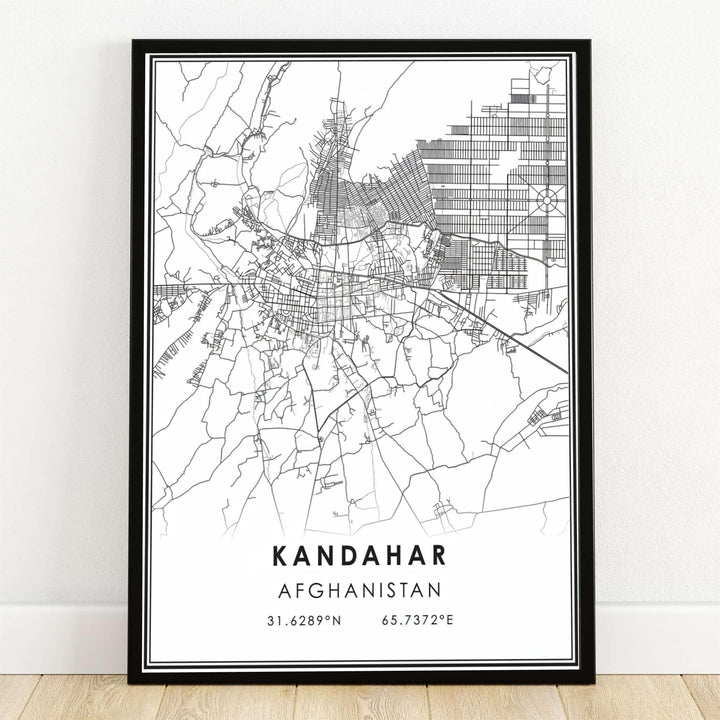 Minimalist black and white city street map poster of Kandahar, Afghanistan, displaying detailed vector road lines and geographic coordinates text. MapYourDreams offers this modern map artwork as an unframed art print, a stretched canvas display, or a sleek black framed poster for contemporary office spaces.