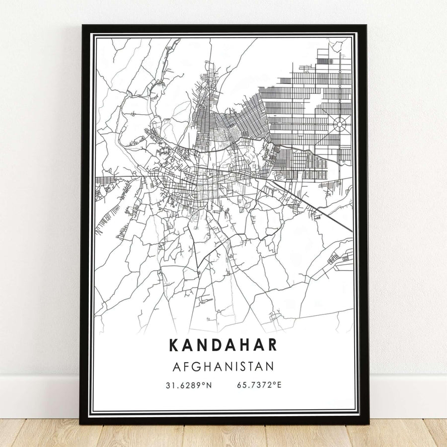 Minimalist black and white city street map poster of Kandahar, Afghanistan, displaying detailed vector road lines and geographic coordinates text. MapYourDreams offers this modern map artwork as an unframed art print, a stretched canvas display, or a sleek black framed poster for contemporary office spaces.