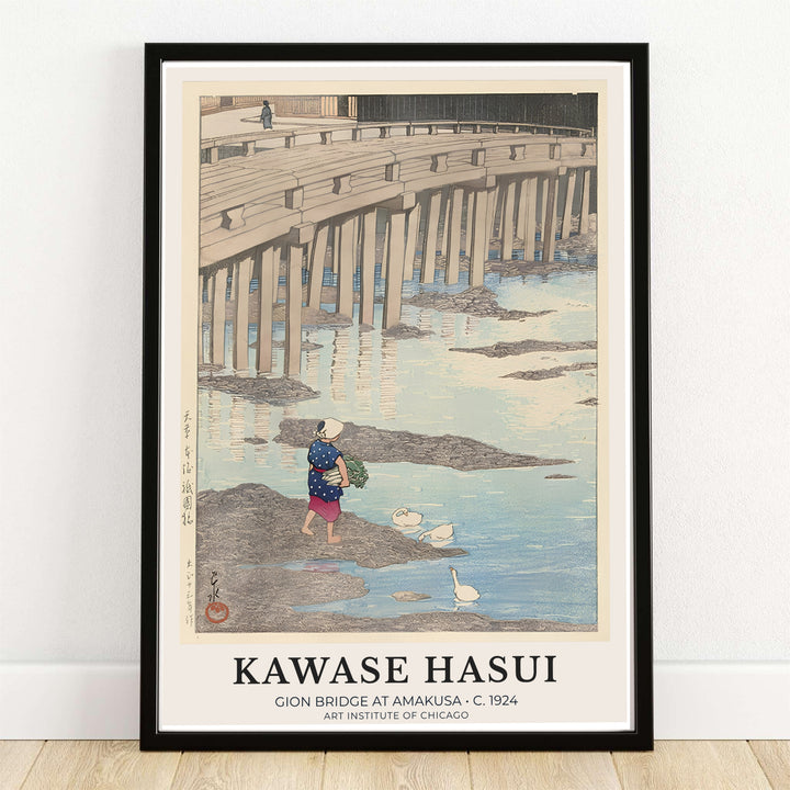Kawase Hasui Gion Bridge Amakusa 1924 Japanese print of Gion Bridge in Amakusa by artist Kawase Hasui displaying a woman carrying greens near river reflections under Gion Bridge in Amakusa. MapYourDreams offers framed, unframed paper, and canvas wall art options.