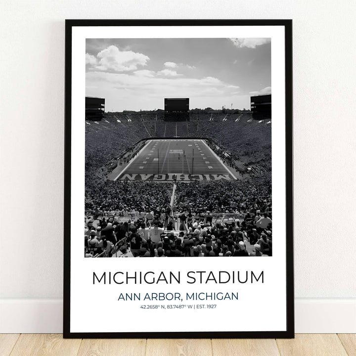 Timeless monochrome sports wall art print of Michigan Stadium in Ann Arbor featuring sweeping field views and cloud dappled sky. Designed by MapYourDreams, this artwork is available in flexible options including unframed paper, custom wooden frames, and gallery canvas wraps for home wall art.