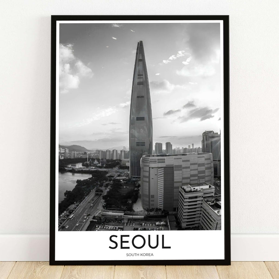 Striking black and white cityscape photo print featuring Lotte World Tower in Seoul, South Korea along the river, presented by MapYourDreams in versatile options including unframed paper, custom wooden frames, and gallery canvas wraps to effortlessly elevate your living room or office wall decor.