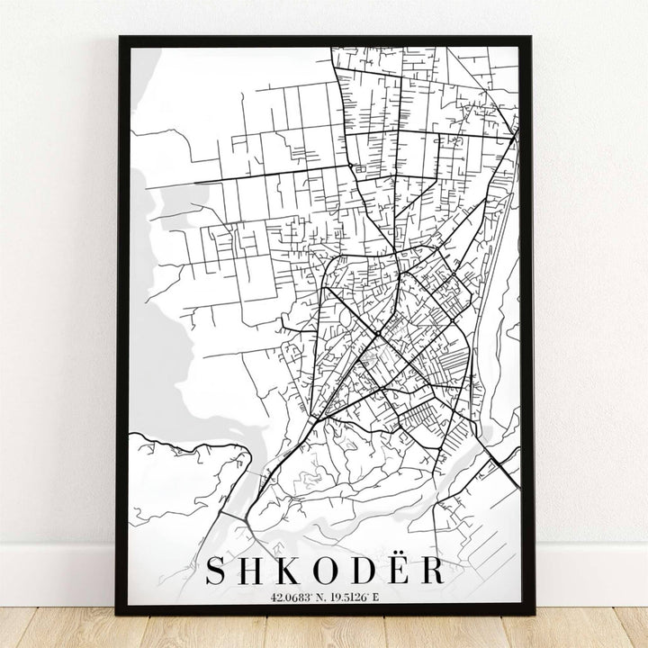 Minimalist black linework outlines the urban streets and lake waterways of Shkodër, Albania, in this crisp white map poster. Offered by MapYourDreams, this artwork is available in flexible options including unframed paper, custom wooden frames, and gallery canvas wraps.