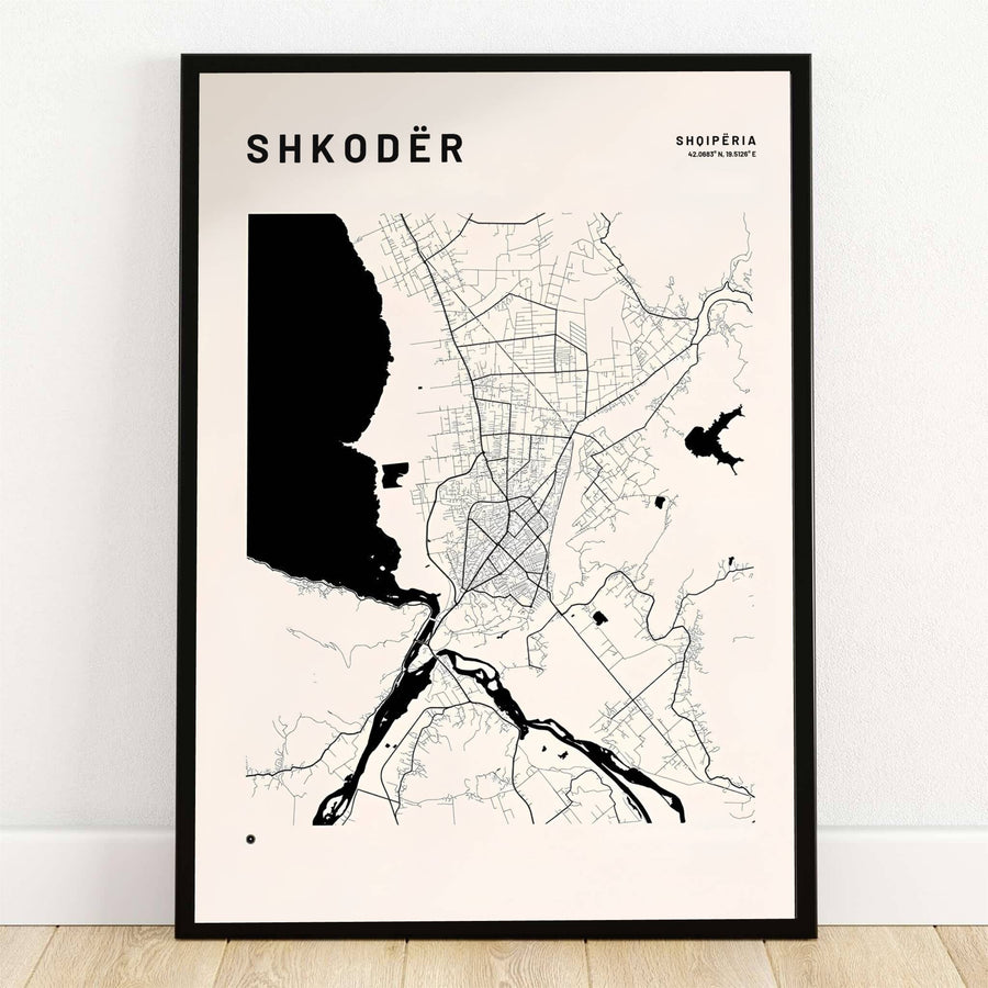 Bold solid black water shapes outline Lake Shkodër alongside fine street linework on a warm off-white map poster. Offered by MapYourDreams, this artwork is available in flexible options including unframed paper, custom wooden frames, and gallery canvas wraps.