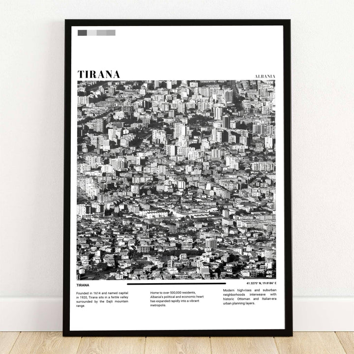 A high-angle aerial photograph of Tirana, Albania, captured in striking Black &amp; White photography, reveals a dense monochrome tapestry of urban rooftops and modern architecture. Offered by MapYourDreams, this photo print is available in flexible options including unframed paper, custom wooden frames, and gallery canvas wraps.