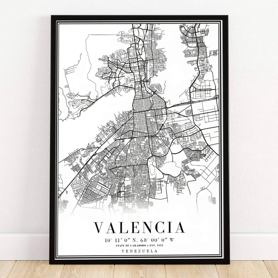 Valencia Venezuela black and white map art print featuring a high-contrast minimalist street grid, highway lines, and geographical coordinates. Crafted by MapYourDreams, this design can be ordered as borderless archival paper, custom wooden frames, or gallery canvas wraps.