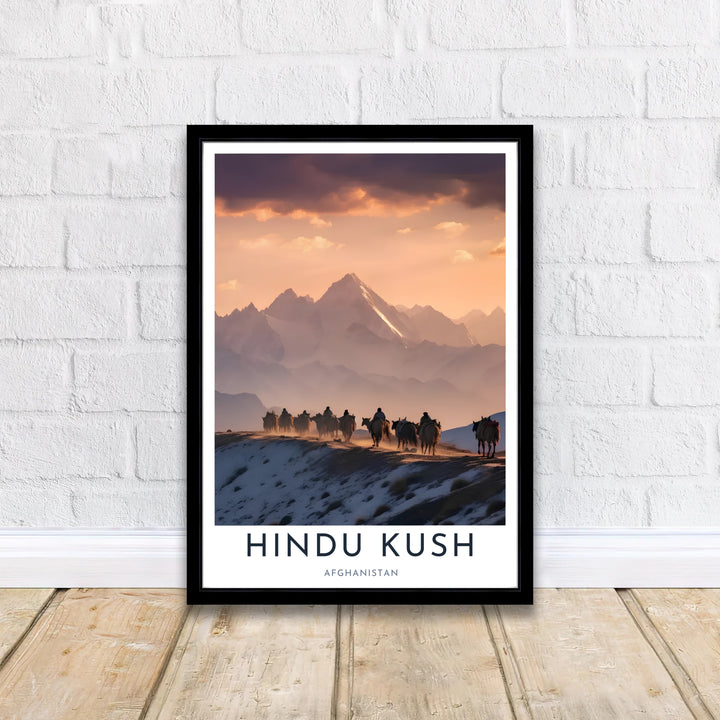 Majestic snow-capped Afghanistan Hindu Kush mountain print showcasing a Kuchi nomad caravan journey under a colorful evening sky, offered by MapYourDreams as an unframed fine art print, stretched gallery canvas, or custom framed wall art decor in classic black and natural wood frame finishes.