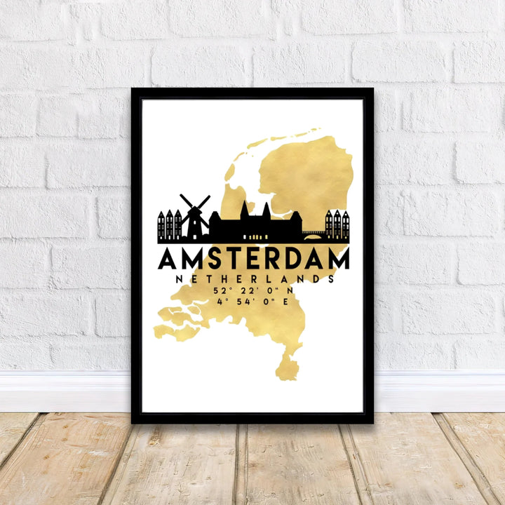 Modern gold cartography decor displaying the map outline of Holland and a black silhouette of traditional windmills and city gables, offered by MapYourDreams in flexible formats such as unframed paper prints, gallery wrapped canvas, or custom framing tailored to fit glam wall decor themes.