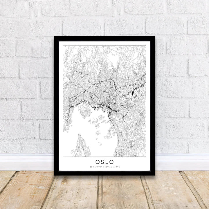 Minimalist cartography poster depicting the street network and coastal layout of Oslo Norway in clean black lines on a white field. Designed to complement contemporary spaces, this piece is produced in simple unframed poster paper, custom wood framed setups, and gallery stretched canvas art.