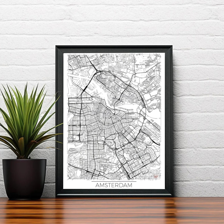 Modern street map decor displaying the urban density and canal ring layout of Amsterdam in sharp black ink on white paper, offered by MapYourDreams in flexible formats such as unframed paper prints, gallery wrapped canvas, or custom framing tailored to fit industrial loft interiors.