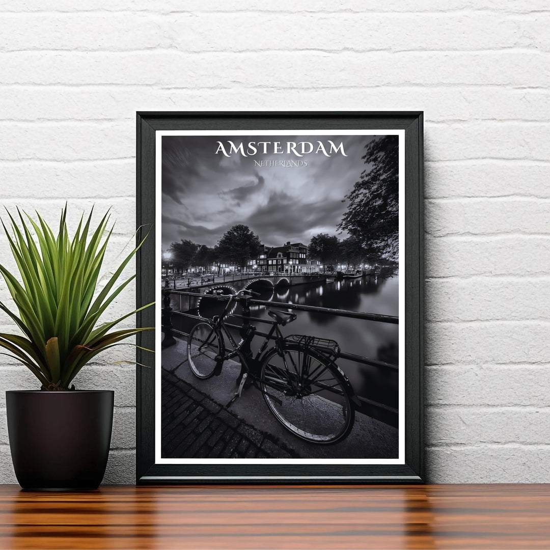 Dramatic night photo art print capturing historic townhouses, cloud-dappled skies, and a bicycle along an Amsterdam canal, available from MapYourDreams with catalog choices for an unframed archival poster, a stretched gallery canvas print, or a custom framed wall display tailored for study rooms.