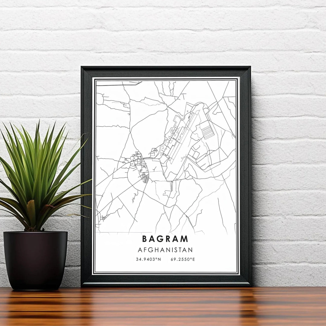 Black and white city map poster of Bagram Afghanistan displaying precise cartographic lines and location coordinates, produced by MapYourDreams with choices including unframed poster prints, canvas wall decor, or custom framed prints in white, bronze, and silver frame selections.