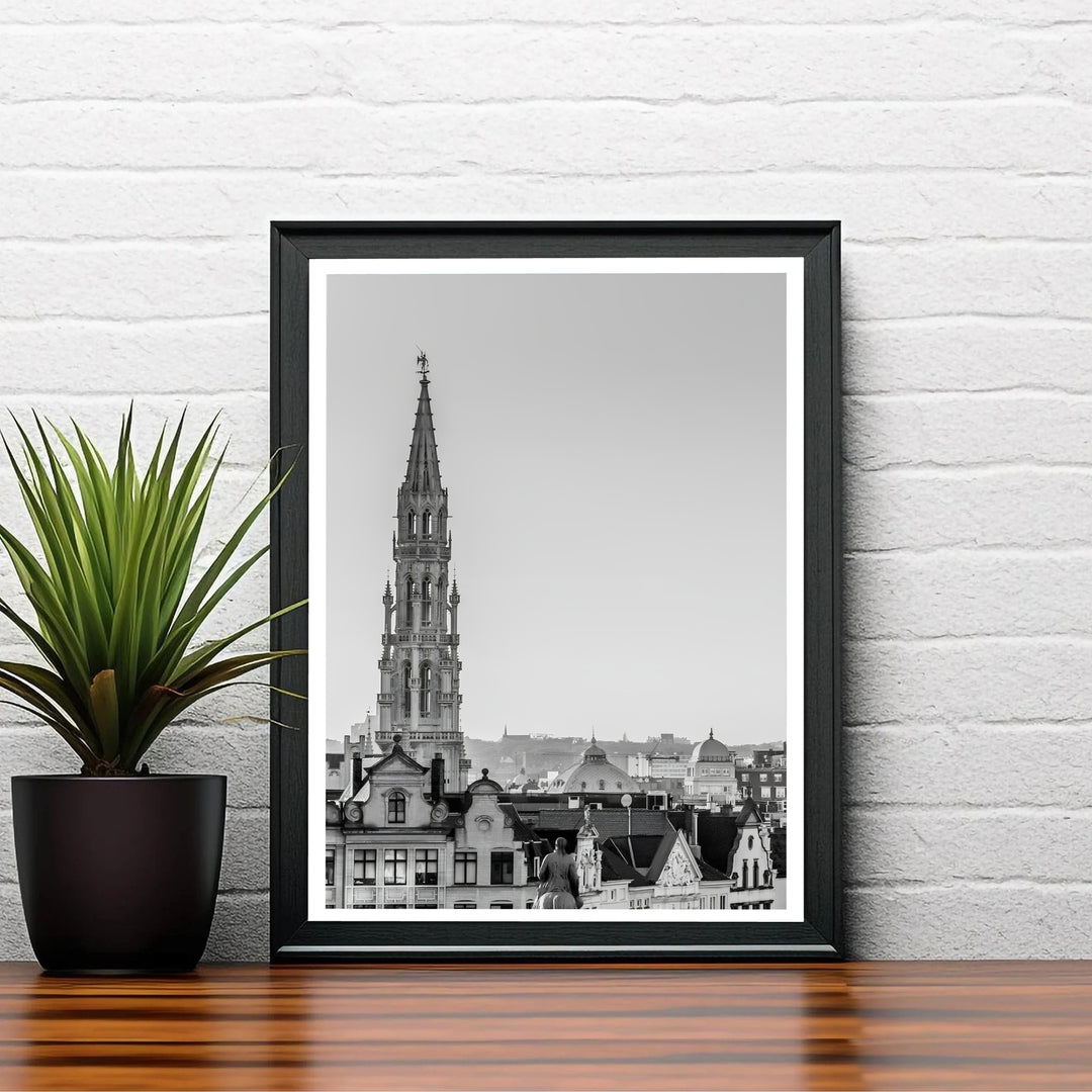 Refined black and white travel poster showcasing the historic skyline view centering on the Town Hall spire of Brussels, Belgium. Choose your preferred finish from standalone unframed matte paper, custom decorative frames, or ready-to-hang gallery canvas options.