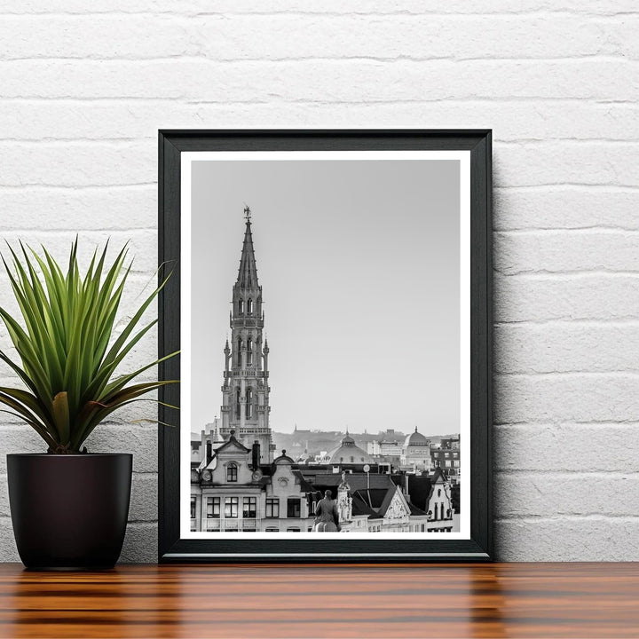 Refined black and white travel poster showcasing the historic skyline view centering on the Town Hall spire of Brussels, Belgium. Choose your preferred finish from standalone unframed matte paper, custom decorative frames, or ready-to-hang gallery canvas options.