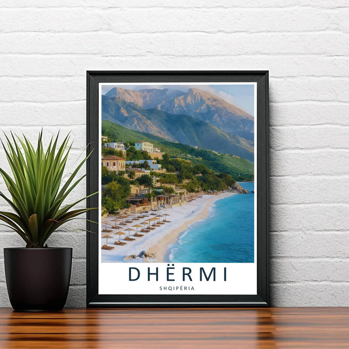 Golden sunlight bathes the coastal village and towering mountain slopes overlooking Dhërmi Beach in this vibrant European photography piece. Order this artwork in your preferred style, such as an unframed paper print, a sleek wood frame, or a stretched canvas wrap.