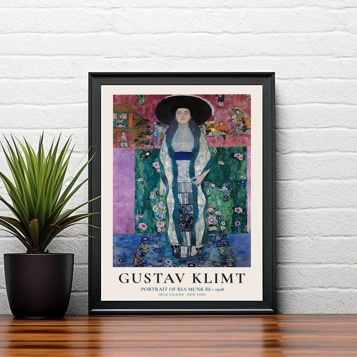 Authentic Secessionist portrait poster of Gustav Klimt Portrait Of Ria Munk III 1918 showing magenta backdrop and detailed dress from Neue Galerie New York. Order custom framed prints, unframed paper wall poster art, or gallery canvas options from MapYourDreams to decorate your space.