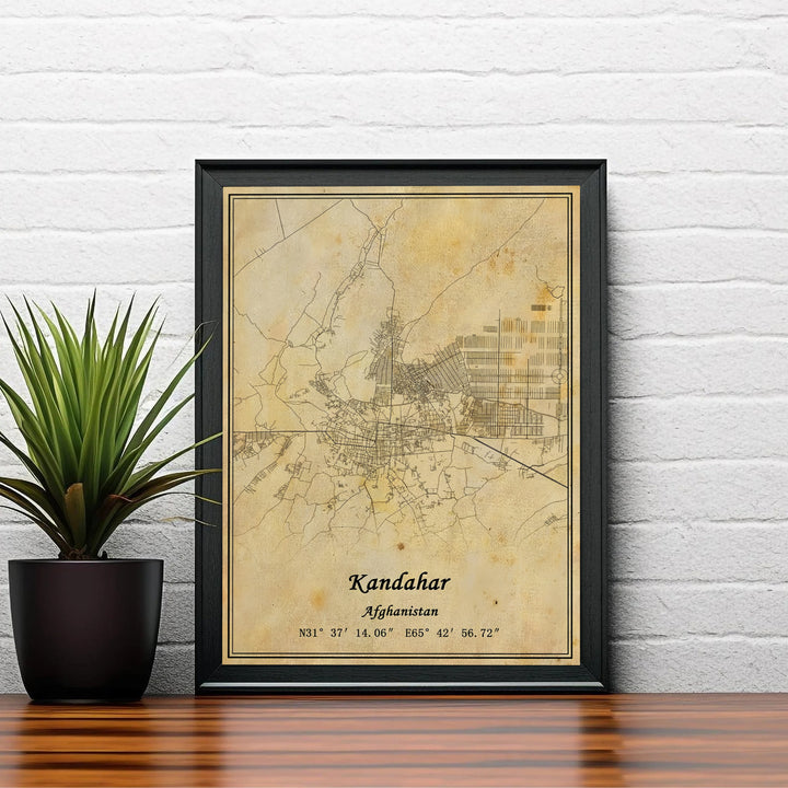 Cartographic wall decor print featuring the detailed urban layout and street paths across Kandahar, Afghanistan, set on a vintage distressed paper design. Created by MapYourDreams with choices including unframed prints, canvas wall art, or custom framed posters in white, bronze, and silver frame selections.