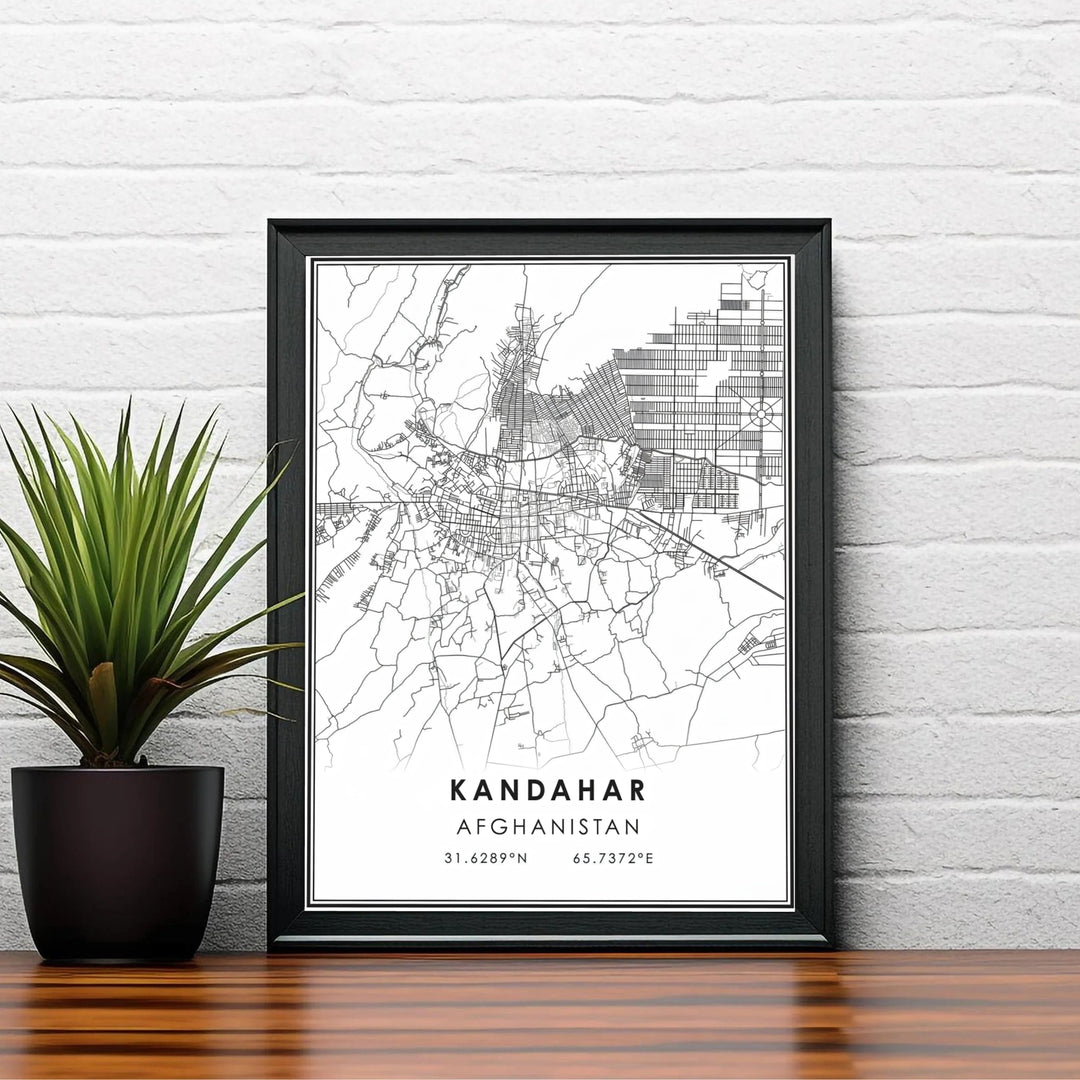 Modern black and white map art print highlighting the road network and geographic coordinate markings of Kandahar, Afghanistan. Available from MapYourDreams as an unframed fine art poster, a stretched gallery canvas, or a custom framed decor piece in classic black and natural wood frame styles.