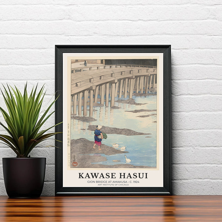 Vintage Japanese river poster Gion Bridge at Amakusa by artist Kawase Hasui displaying calm water reflections and geese at Gion Bridge in Amakusa. Shop high-definition framed, unframed, and canvas art print choices at MapYourDreams.