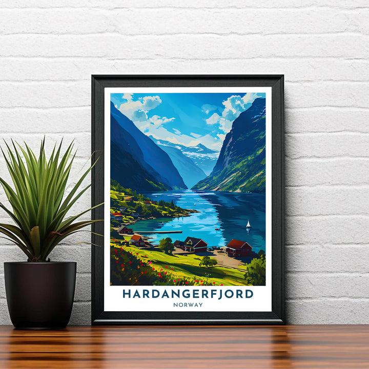 Sunlit Scandinavian artwork depicting Hardangerfjord Norway with traditional Nordic architecture and vibrant summer vegetation along the shore. Perfect for hallway or office layouts, choose from custom framed options, unframed fine art paper prints, or gallery wrapped canvas displays.
