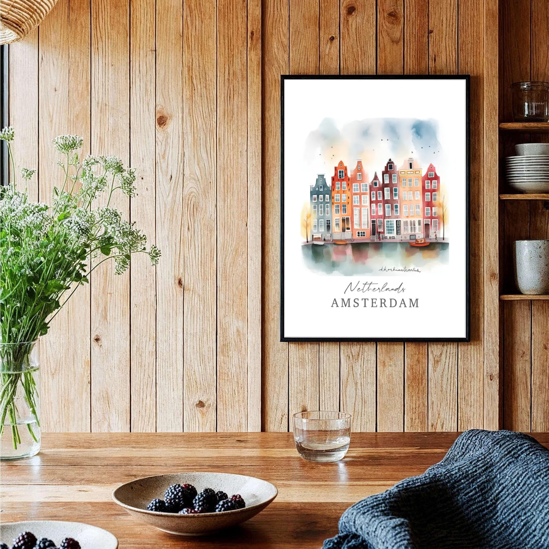Whimsical watercolor city poster of historic Amsterdam canal architecture fronted by water reflections and flying birds, provided by MapYourDreams with available options like unframed paper prints, gallery canvas, or custom frame finishes in natural wood, pure gold, and bronze for offices.