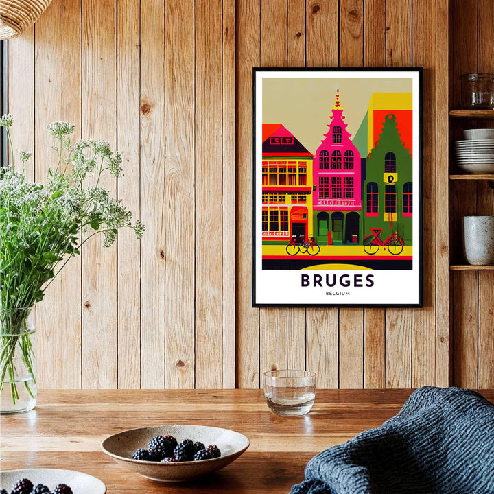 A modern pop art poster highlighting the famous step-gabled facades and city streets of Bruges, Belgium, in saturated magenta, green, and golden yellow hues. Offered by MapYourDreams, this artwork is available in flexible options including unframed paper, custom wooden frames, and gallery canvas wraps.