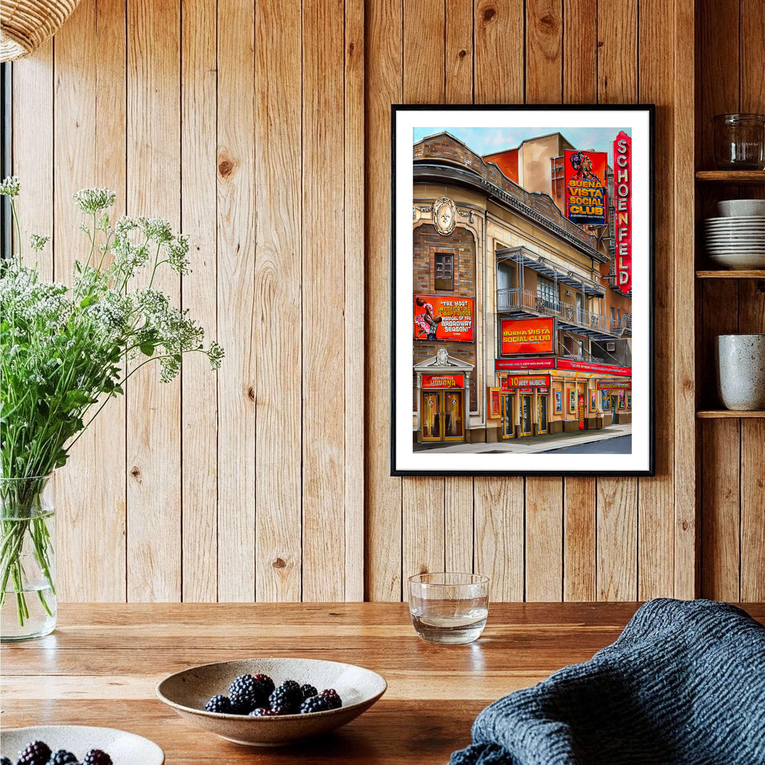 Crimson red and warm terracotta poster of the Gerald Schoenfeld Theatre on Broadway featuring intricate balcony details and marquee lighting, provided by MapYourDreams with available options like unframed paper prints, gallery canvas, or custom frame finishes in natural wood, pure gold, and bronze.