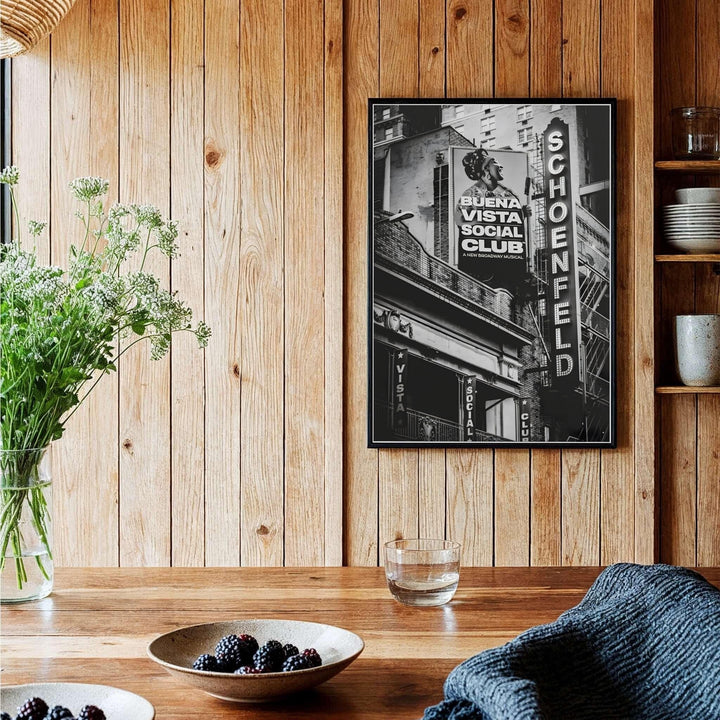 Dramatic black and white poster of the Gerald Schoenfeld Theatre on Broadway featuring intricate balcony details and vertical marquee lighting, provided by MapYourDreams with available options like unframed paper prints, gallery canvas, or custom frame finishes in natural wood, pure gold, and bronze.