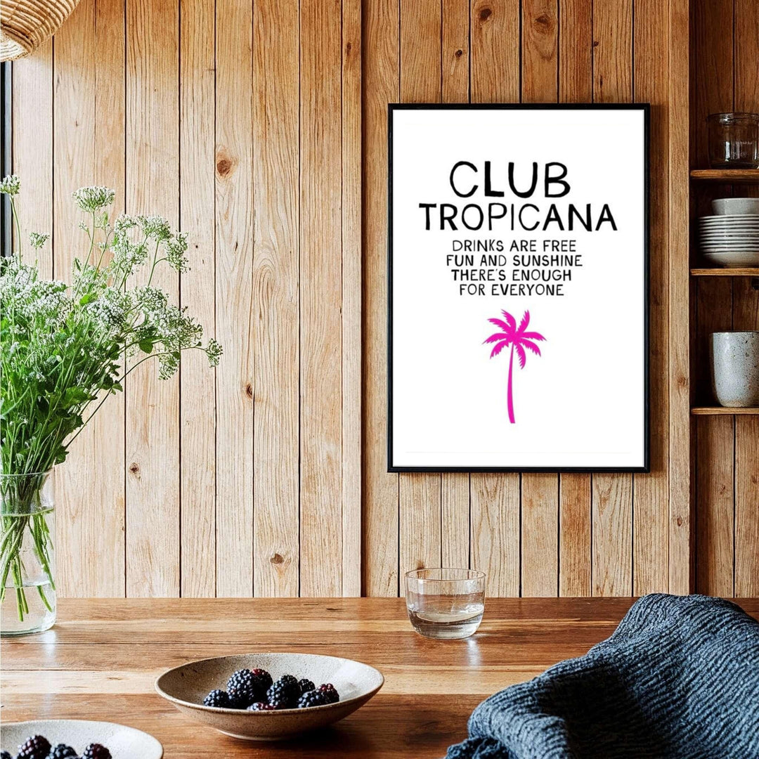 Tropical beach house poster featuring black text and a pink palm silhouette against white background for Club Tropicana, provided by MapYourDreams with options like unframed paper, gallery canvas, or custom frames in natural wood, pure gold, and retro white.