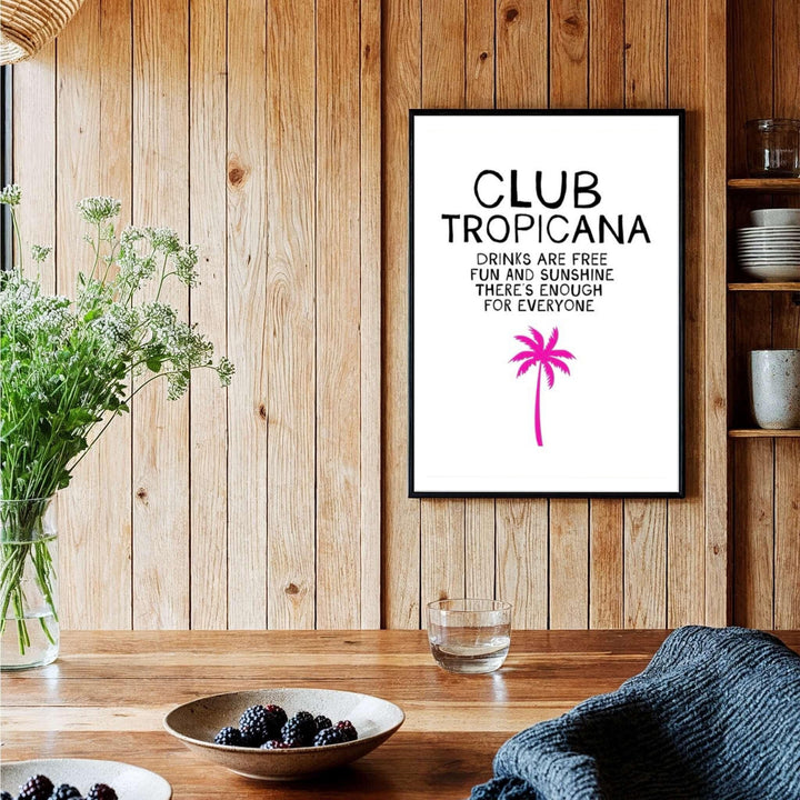Tropical beach house poster featuring black text and a pink palm silhouette against white background for Club Tropicana, provided by MapYourDreams with options like unframed paper, gallery canvas, or custom frames in natural wood, pure gold, and retro white.