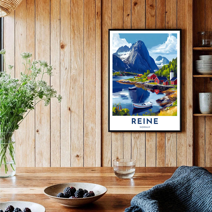 Alpine harbor poster showing the coastal village of Reine Norway with red rorbuer houses clustered beneath dramatic mountain summits. Designed to suit any room aesthetic, this print is produced in simple unframed poster paper, custom wood framed setups, and gallery stretched canvas art.