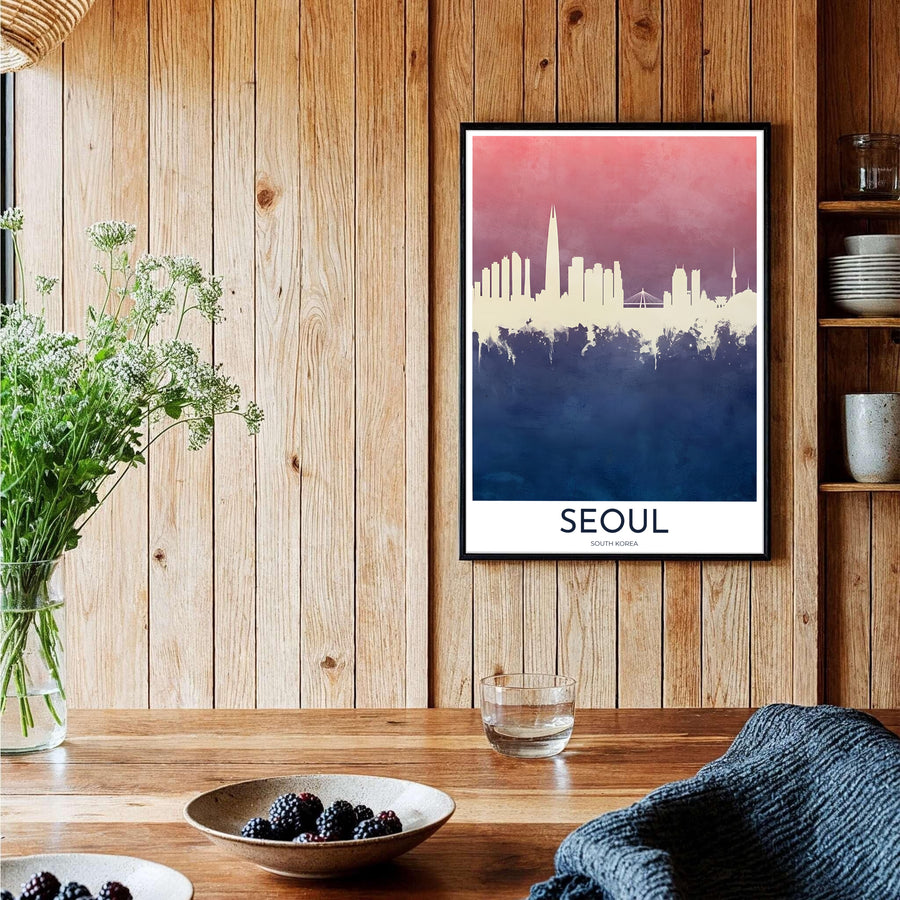 Stylish living room decor print showing the skyline of Seoul, South Korea, with a blush pink upper sky blending into a dark navy blue water splatter effect base. Offered by MapYourDreams, this artwork is available in flexible options including unframed paper, custom wooden frames, and gallery canvas wraps.