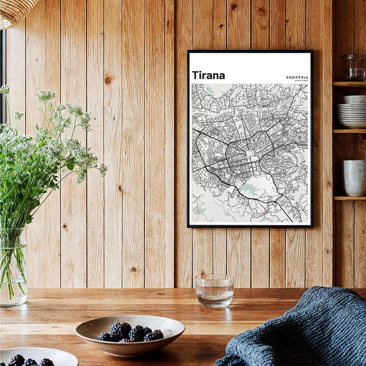A sophisticated grey and black geographical map of Tirana, Albania, framed by clean borders in a vertical portrait format. Available across multiple formats including unframed paper, tailored wooden frames, and gallery-wrapped canvas options.