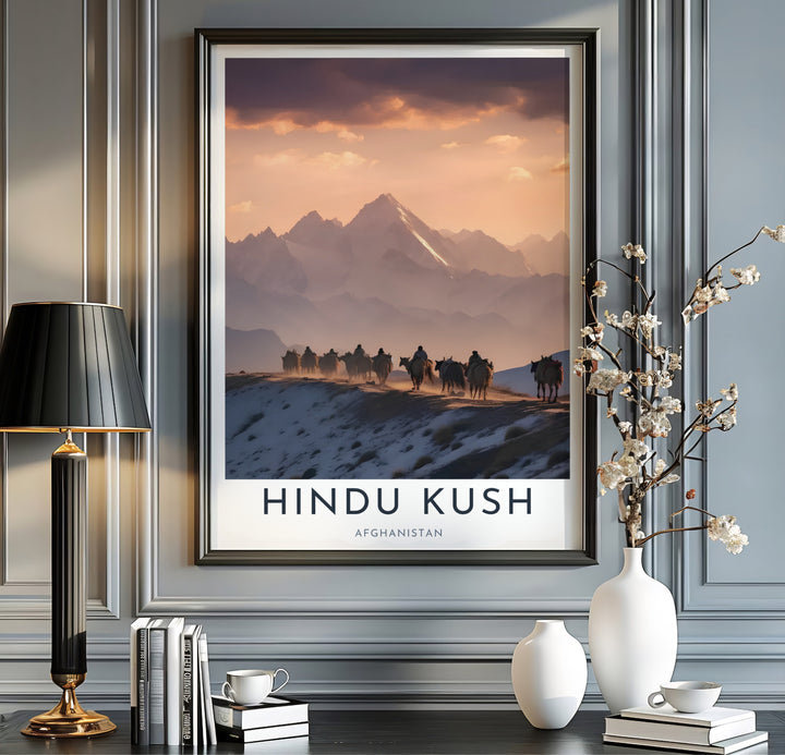 Sunset landscape poster of the Afghanistan Hindu Kush range displaying a Kuchi nomad migration in mountain snow, presented by MapYourDreams as an unframed paper print, gallery canvas wall decor, or custom framed wall art in grey and black frames for entryway wall arrangement.