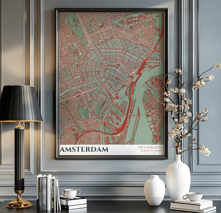 Graphic cartography travel poster of the Amsterdam street grid featuring red vector lines, sage green landmasses, and geographic coordinates, offered by MapYourDreams as an unframed poster, a gallery wrapped canvas, or within a selection of custom frames for sleek apartment wall decor.