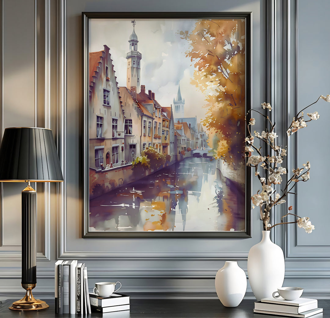 A Bruges Belgium canal print showcasing historic architecture, soft water reflections, and golden autumn leaves rendered in fluid watercolor style. Available from MapYourDreams in multiple presentation formats including unframed archival paper, handcrafted frames, and gallery wrapped canvas styles.