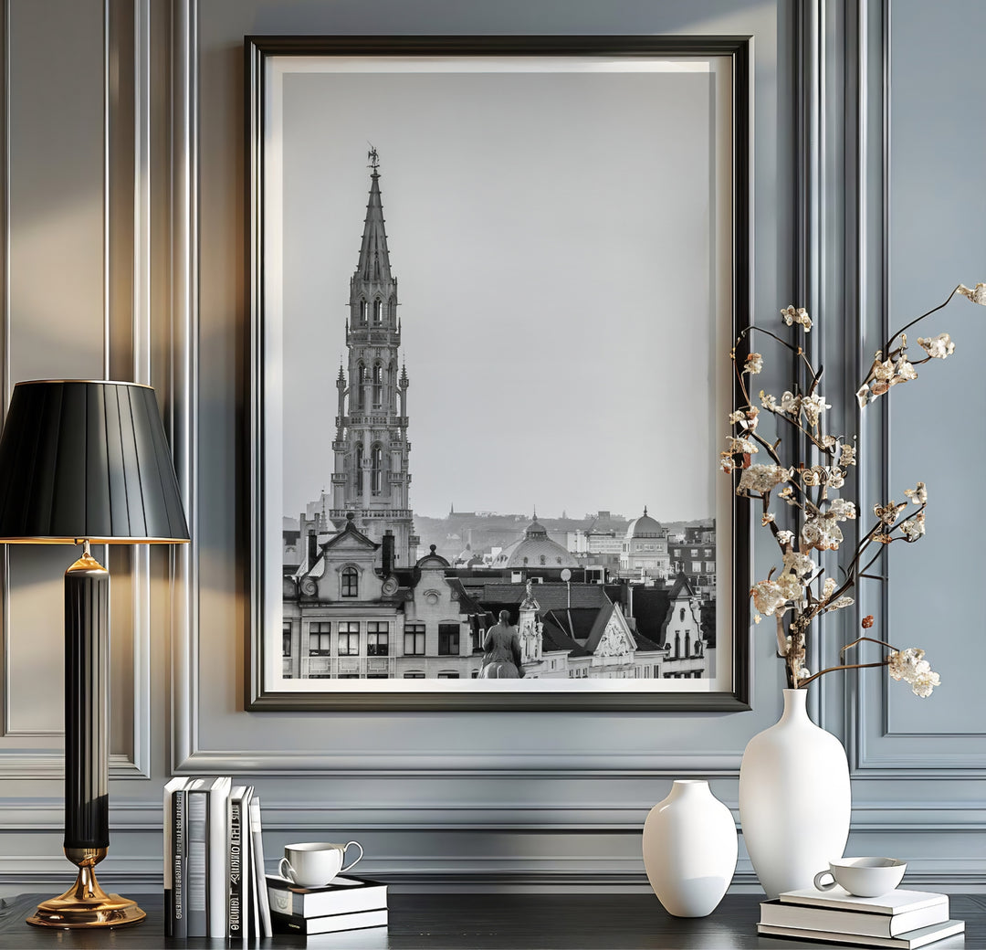 Minimalist architectural wall poster displaying the soaring Gothic tower of Brussels, Belgium, in sharp black and white contrast. Available from MapYourDreams in multiple presentation formats including unframed archival paper, handcrafted frames, and gallery wrapped canvas styles.