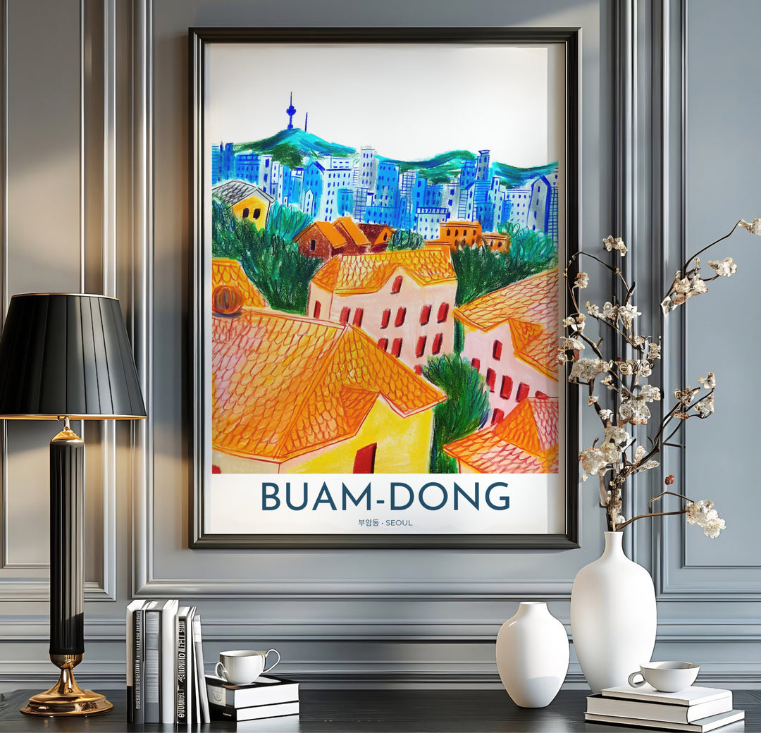 Modern art print of Buam-dong, Seoul, with crisp text reading BUAM-DONG SEOUL below a hand-sketched illustration of colorful rooftops, mountain greens, and N Seoul Tower. Offered by MapYourDreams, this artwork is available in flexible options including unframed paper, custom wooden frames, and gallery canvas wraps.