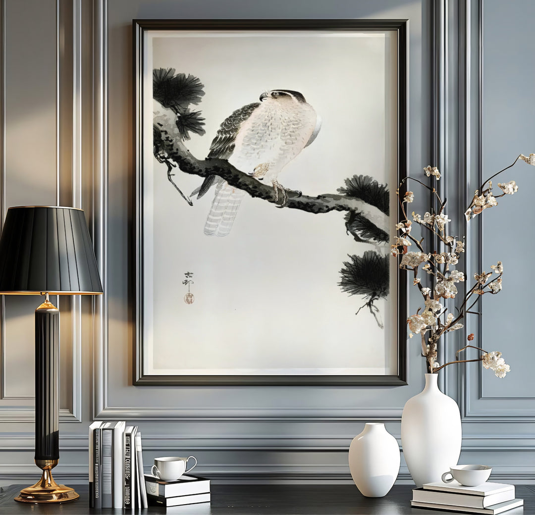 Japanese falcon perched on gnarled pine tree by artist Ohara Koson inspired by Japanese garden pavilions in Kyoto. MapYourDreams offers versatile framed, unframed, and canvas print wall decor formats.