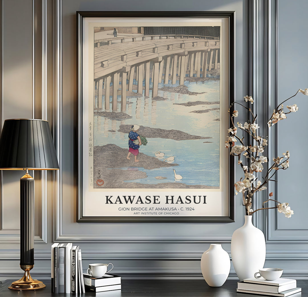 Japanese historic travel print Gion Bridge at Amakusa with local woman carrying greens by artist Kawase Hasui inspired by rural life at Gion Bridge in Amakusa. MapYourDreams offers versatile framed, unframed, and canvas print wall decor formats.