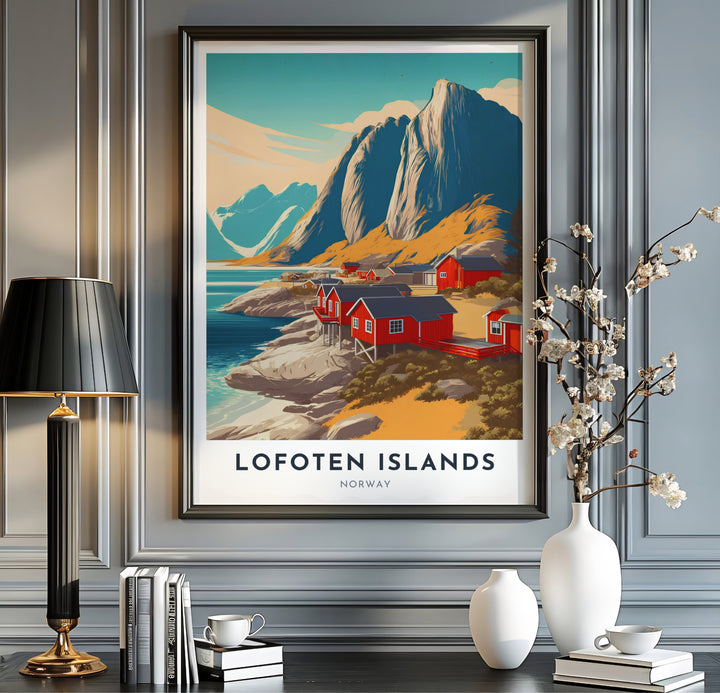 Breathtaking view of towering coastal cliffs and red fishing cabins in Lofoten Islands Norway reflecting across calm shoreline waters. This travel landscape piece is offered across multiple formats including custom framed prints, premium canvas stretched artwork, and classic unframed poster options.