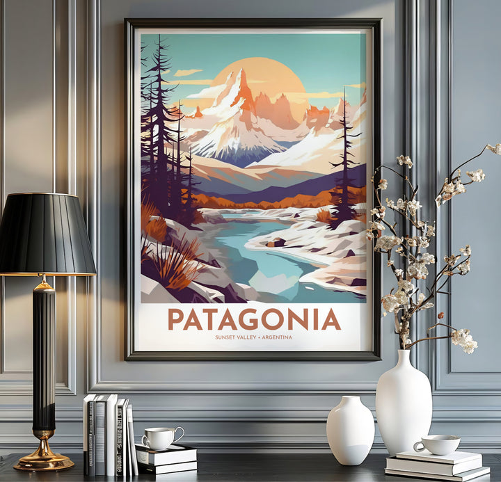 Rendered in a bold modern vector style, this Patagonia Sunset Mountain Art Print depicts Mount Fitz Roy in Argentina alongside a glowing sun and turquoise stream, designed by MapYourDreams in unframed, framed, and canvas finishes.