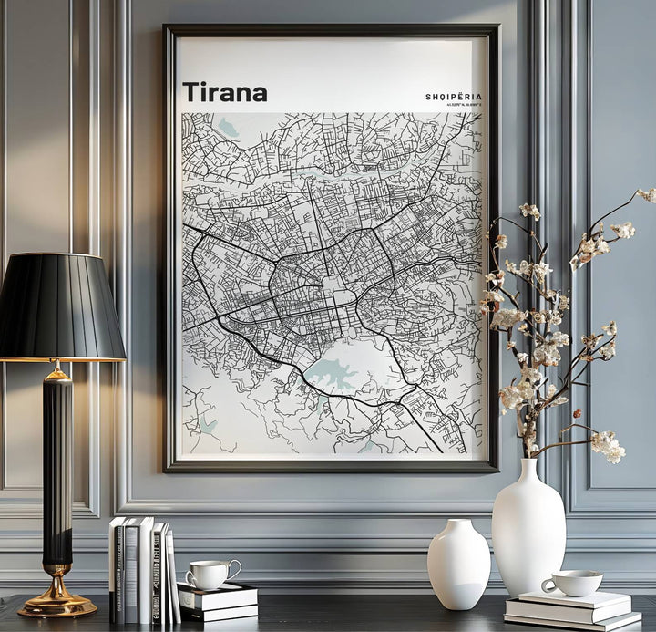 Minimalist street lines form a beautiful abstract geometric pattern in this vertical road map poster of Tirana, Albania. MapYourDreams provides flexible choices like unframed archival paper, custom frames in various finishes, and stretched canvas.