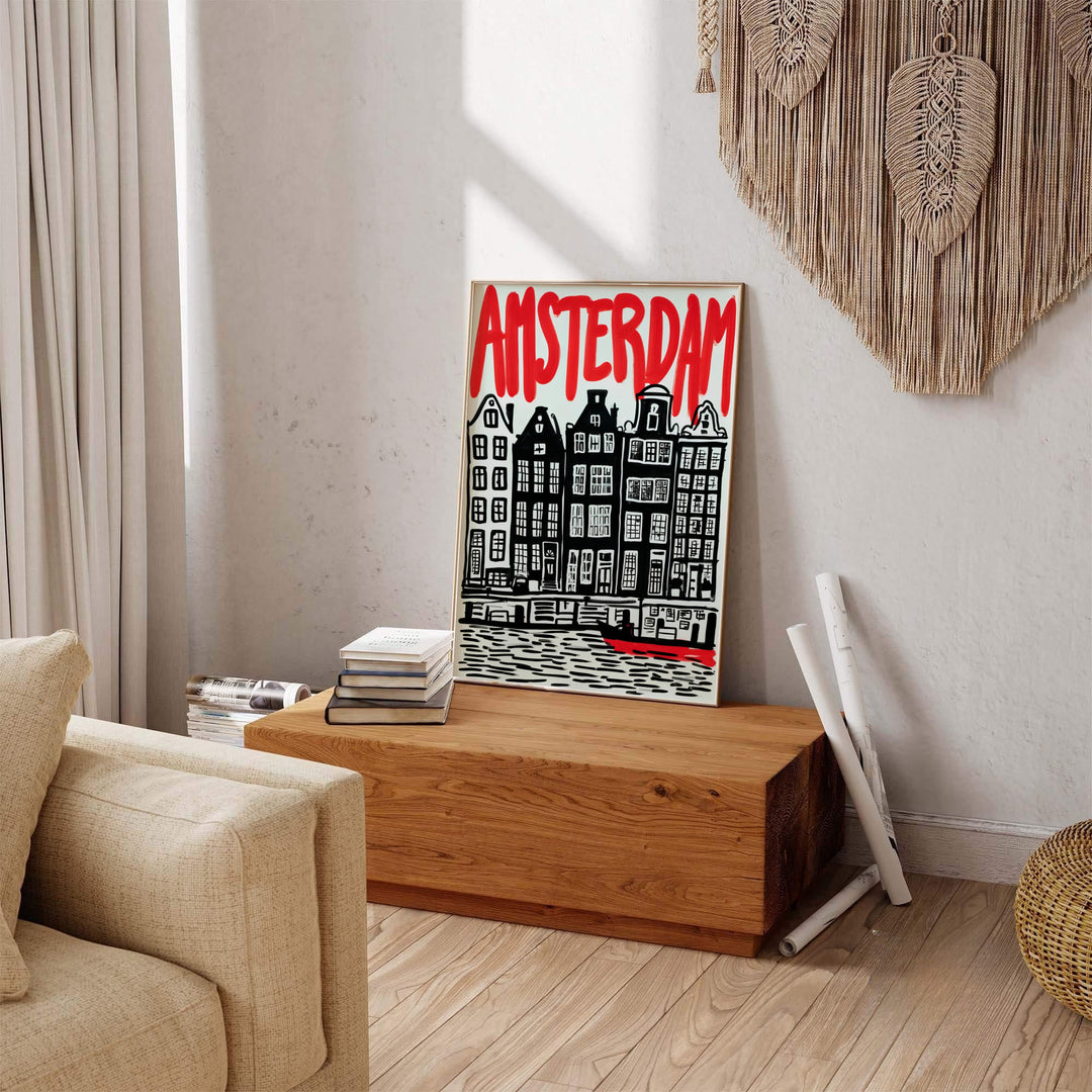 Bold travel decor print of Amsterdam canal architecture rendered in expressive red and black linocut style, produced by MapYourDreams and available in three distinct formats: fine art unframed paper, stretched canvas, or custom framed decor options for modern homes.