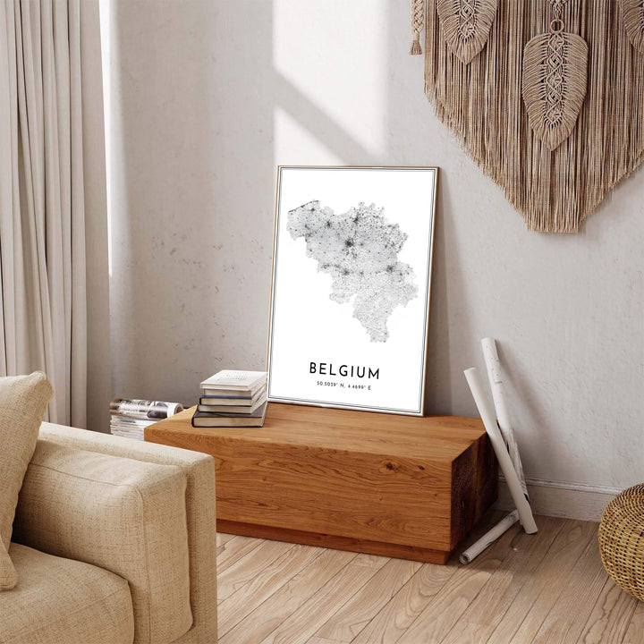 A minimalist cartography poster of Belgium featuring bold country text, coordinates, and intricate road lines on a bright white field. Available across multiple options including unframed art paper, custom framed poster styles, and gallery canvas wall displays.