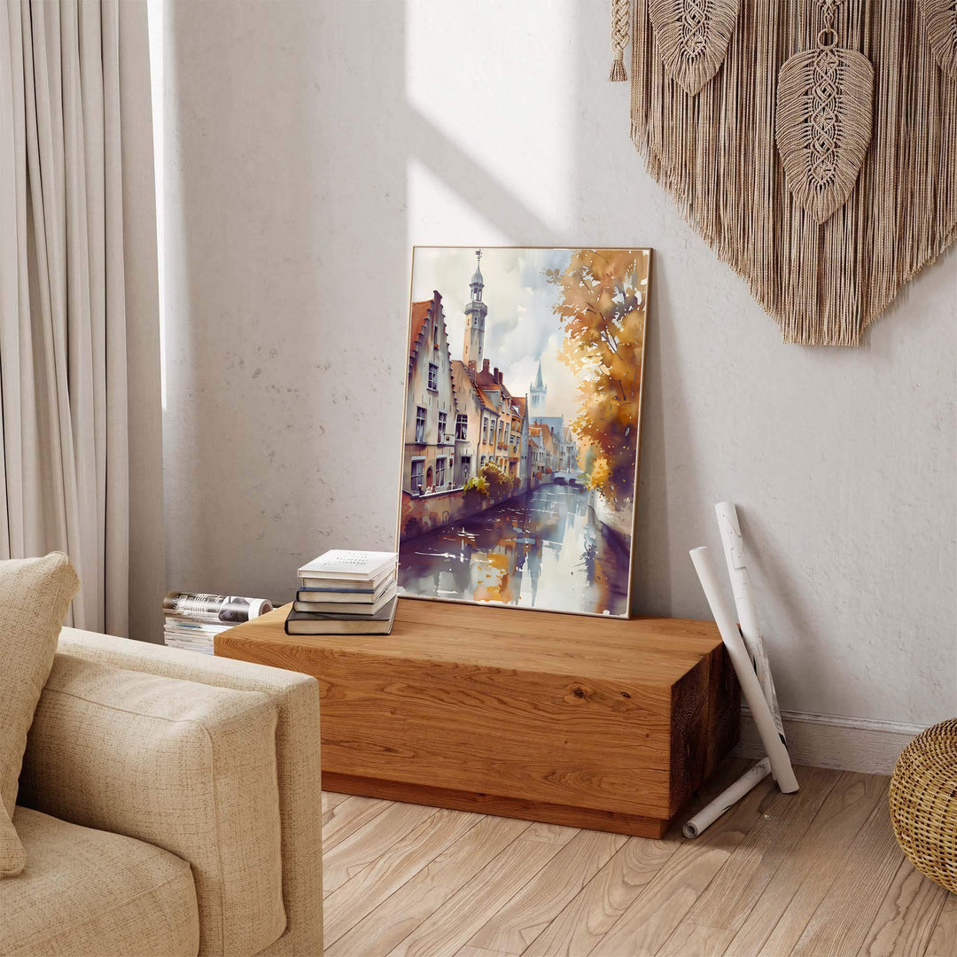 A serene watercolor travel poster depicting the canal reflections and historic step-gables of Bruges, Belgium, surrounded by fall foliage. Available across multiple options including unframed art paper, custom framed poster styles, and gallery canvas wall displays.
