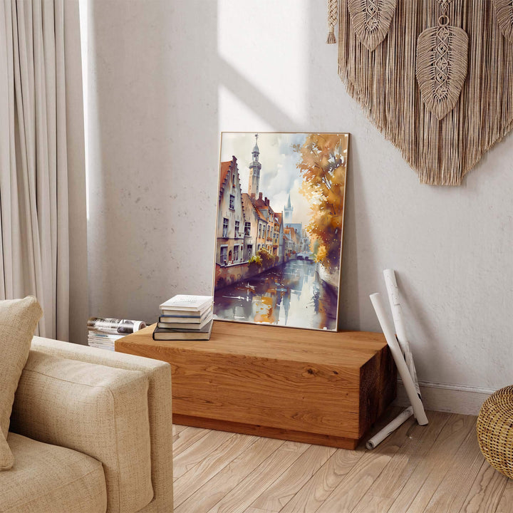 A serene watercolor travel poster depicting the canal reflections and historic step-gables of Bruges, Belgium, surrounded by fall foliage. Available across multiple options including unframed art paper, custom framed poster styles, and gallery canvas wall displays.