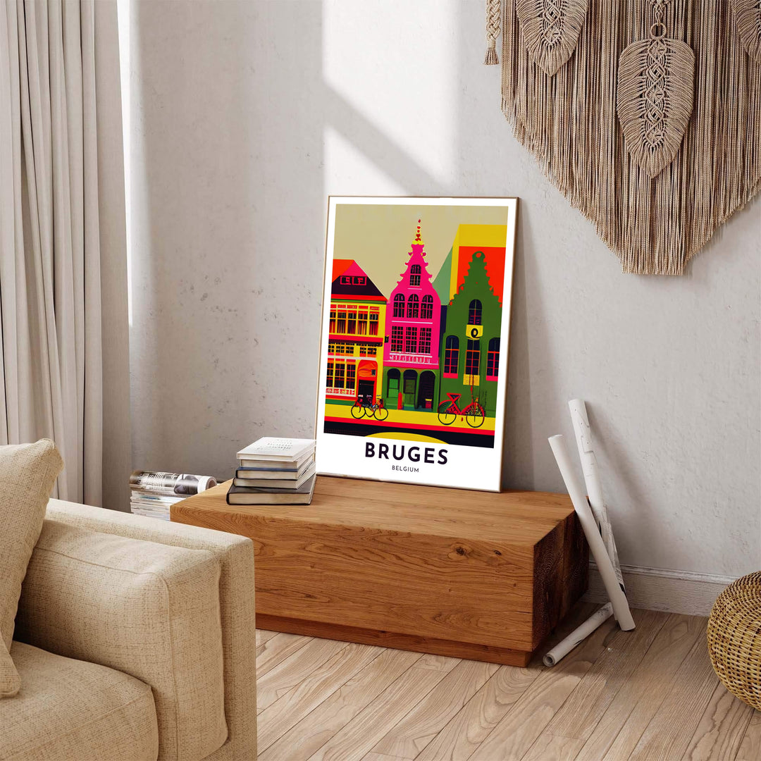 A modern travel poster depicting bright pink and green townhouses with bicycles in Bruges, Belgium, finished with crisp text reading Bruges Belgium. Available across multiple options including unframed art paper, custom framed poster styles, and gallery canvas wall displays.